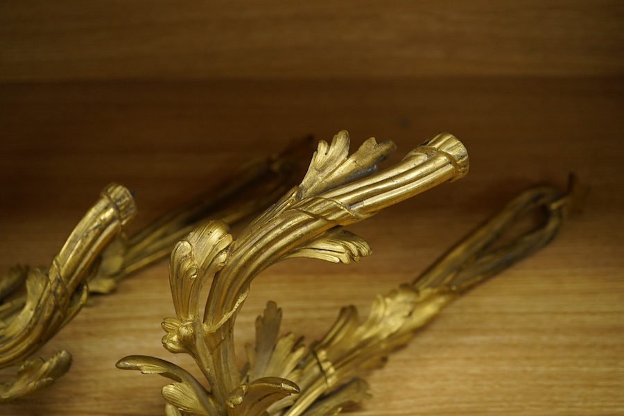 A pair of Rococo style ormolu wall lights, 74cm high. Condition - fair